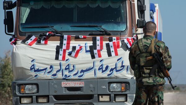 Конвой, доставивший гуманитарную помощь, в поселок Ибта, контролируемый формированиями объявившими о прекращении огня