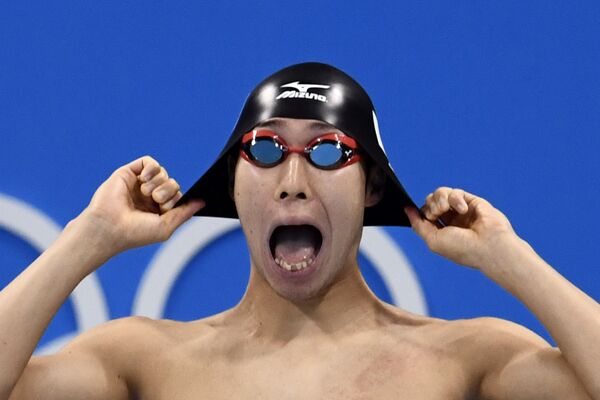 Участник из сборной Японии по плавания во время соревнований на летних Олимпийских играх в Рио-де-Жанейро