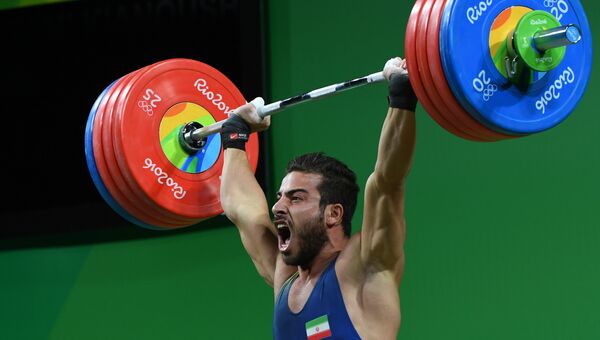 Иранский штангист Киануш Ростами обновил мировой рекорд и выиграл золото Олимпийских игр в Рио в весовой категории до 85 кг. 13 августа 2016 год