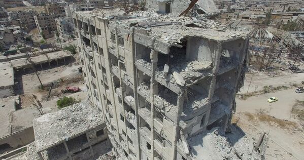 Разрушенные здания в квартале Бани-Зейд на севере Алеппо