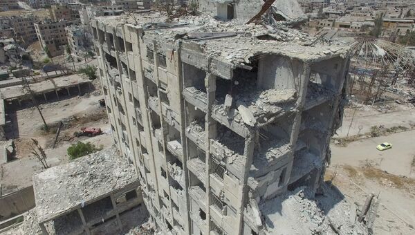Разрушенные здания в квартале Бани-Зейд на севере Алеппо