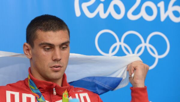 Российский боксер Евгений Тищенко, завоевавший золотую медаль на XXXI летних Олимпийских играх. Архивное фото