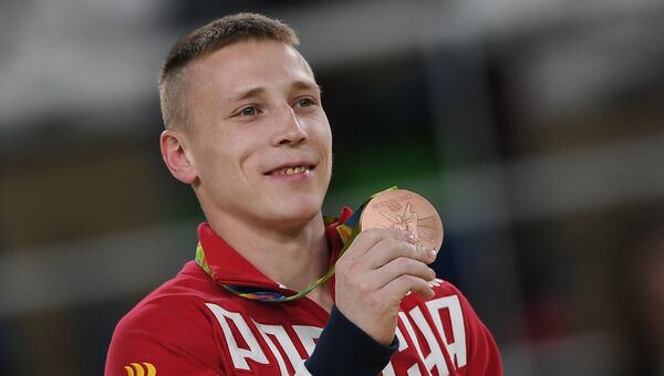 Российский гимнаст Денис Аблязин, завоевавший бронзовую медаль в упражнениях на кольцах на XXXI летних Олимпийских играх