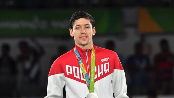 Алексей Денисенко, завоевавший серебряную медаль в соревнованиях по тхэквондо на XXXI Олимпийских играх