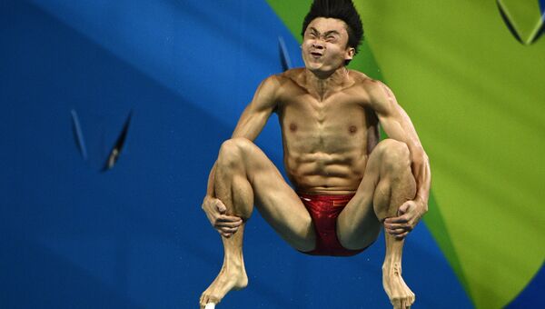 Китайский спортсмен Цао Юань во время выступления на Олимпийских играх в Рио-де-Жанейро