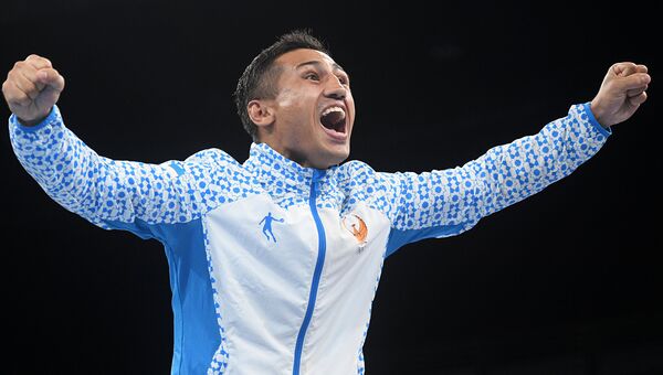Фазлиддин Гаибназаров (Узбекистан), завоевавший золотую медаль в соревнованиях по боксу на XXXI летних Олимпийских играх