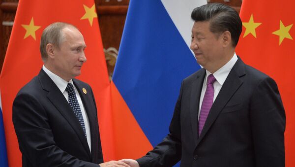 Президент РФ Владимир Путин и председатель КНР Си Цзиньпин. Архивное фото