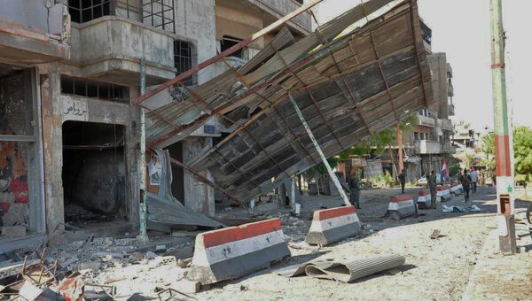 На месте взрыва в сирийском городе Хомс. 5 сентября 2016