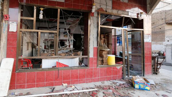 Место взрыва в районе Эль-Каррада в Багдаде. 6 сентября 2016