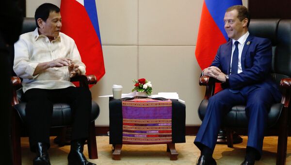 Председатель правительства РФ Дмитрий Медведев и президент Филиппин Родриго Дутерте во время встречи в Вьентьяне. 8 сентября 2016