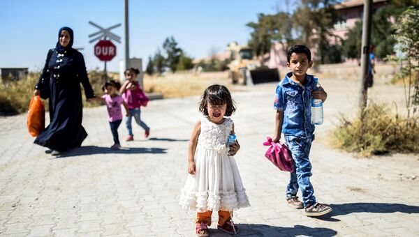 Сирийские беженцы в городе Джераблус, Сирия. Сентябрь 2016. Архивное фото