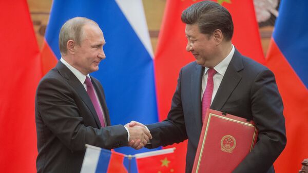 Президент России Владимир Путин и председатель Китайской Народной Республики (КНР) Си Цзиньпин. Архивное фото