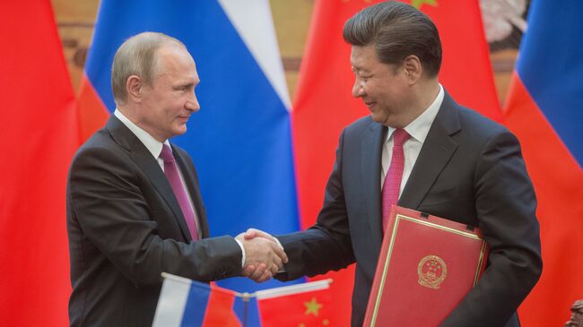 Президент России Владимир Путин и председатель Китайской Народной Республики (КНР) Си Цзиньпин. Архивное фото