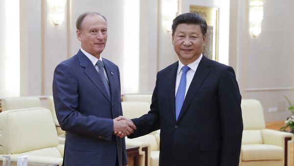 Секретарь Совета безопасности РФ Николай Патрушев и председатель КНР Си Цзиньпин во время встречи в Пекине. 14 сентября 2016