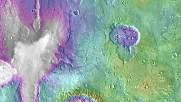 Котловина древнего озера (“Сердце”) на Марсе (пятно сверху слева)