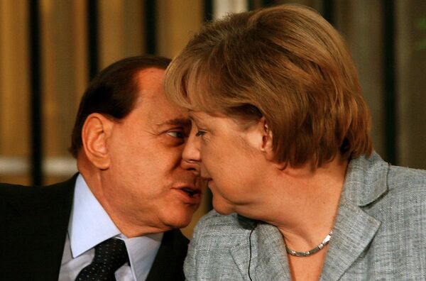 Сильвио Берлускони и Ангела Меркель во время пресс-конференции в Иерусалиме