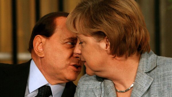 Сильвио Берлускони и Ангела Меркель во время пресс-конференции в Иерусалиме