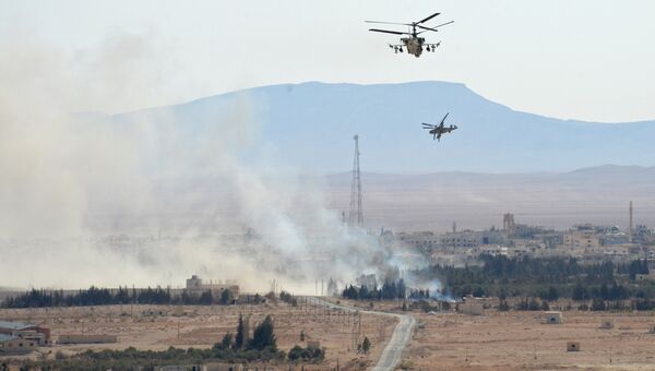 Вертолеты Ка-52 Аллигатор в окрестностях освобожденного от боевиков города Эль-Карьятейн. Архивное фото
