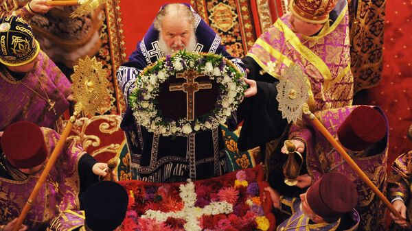 Патриарх Кирилл во время богослужения в честь  Воздвижения Креста Господня. Арихивное фото