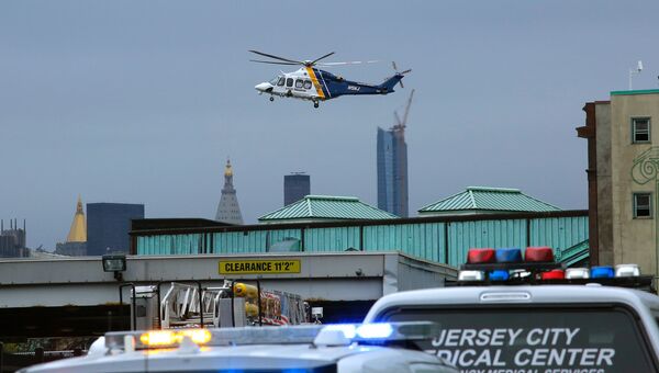 Вертолет над местом железнодорожной катастрофы на станции города Хобокен в штате Нью-Джерси, США. 29 сентября 2016