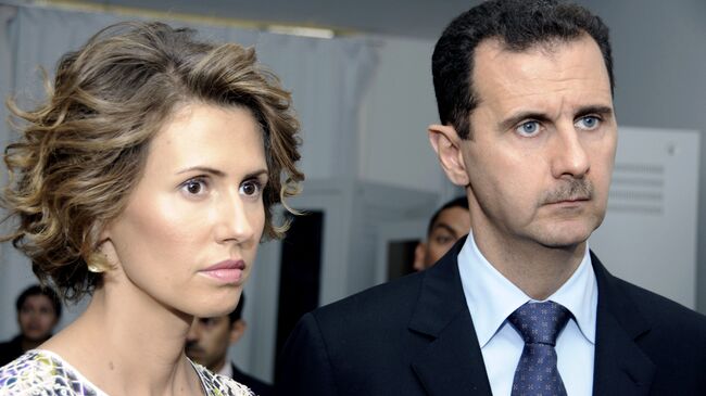 Президент Сирии Башар Асад с супругой Асмой Асад. Архивное фото