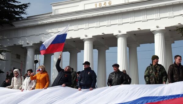 Участники праздничных мероприятий, посвященных годовщине присоединения Крыма к России. Архивное фото