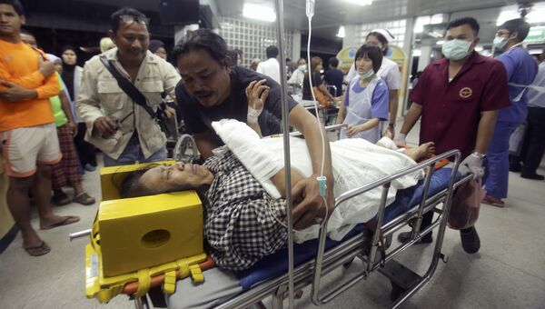 Пострадавшая женщина в больнице после взрыва на рынке в провинции Паттани в Таиланде. 24 октября 2016