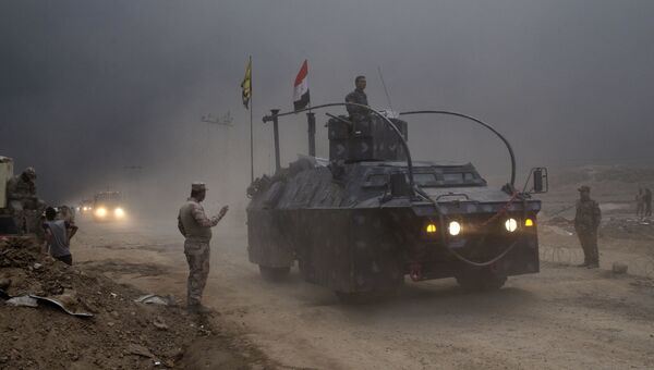 Иракский военный автомобиль в городе Кайяра к югу от Мосула