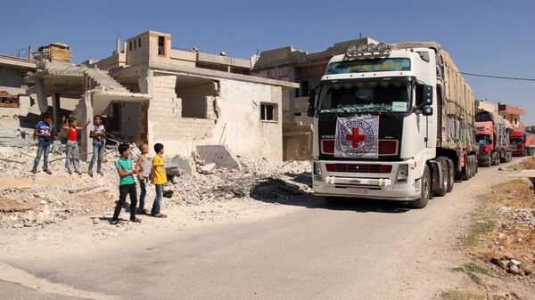 Колонна грузовиков с гуманитарной помощью в Сирии. Архивное фото