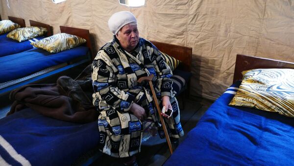 Женщина в пункте для оказания первой медицинской помощи в ДНР. Архивное фото