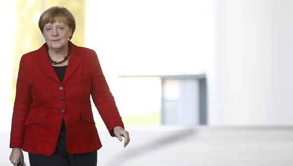 Канцлер ФРГ Ангела Меркель перед выступлением по итогам президентских выборов в США в Берлине. 9 ноября 2016