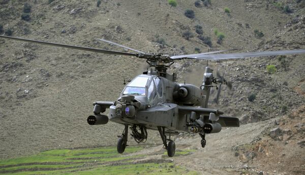 Американский вертолет AH-64 Apache. Архивное фото Американский вертолет AH-64 Apache. Архивное фото