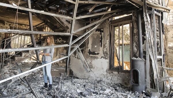 Сгоревший в результате лесных пожаров дом в городе Зихрон-Яаков, Израиль. 23 ноября 2016