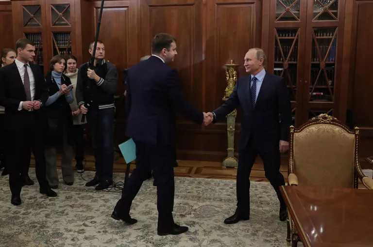 Президент РФ Владимир Путин и заместитель министра финанасов Максим Орешкин во время встречи в Кремле. 30 ноября 2016 Президент РФ Владимир Путин и заместитель министра финанасов Максим Орешкин во время встречи в Кремле. 30 ноября 2016