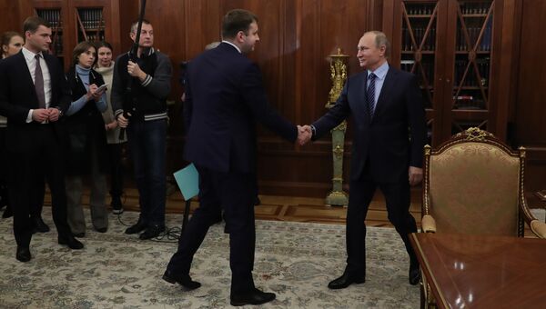 Президент РФ Владимир Путин и заместитель министра финанасов Максим Орешкин во время встречи в Кремле. 30 ноября 2016
