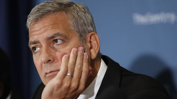 Американский актер Джордж Клуни во время пресс-конференции в Вашингтоне. 12 сентября 2016 года 