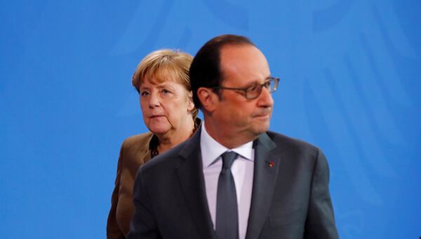 Президент Франции Франсуа Олланд и канцлер Германии Ангела Меркель на совместной пресс-конференции в Берлине. 13 декабря 2016 года