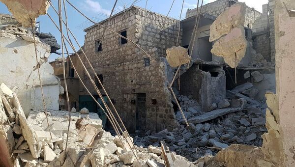 Разрушенные здания в освобожденном квартале восточного Алеппо в Сирии. Архивное фото