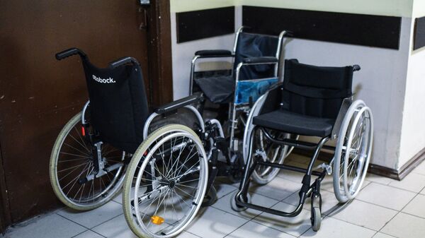 Инвалидная коляска. Архивное фото.
