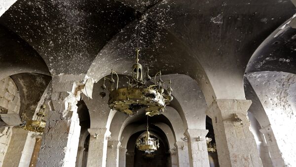 Поврежденные арки в Мечети Омейядов в Алеппо