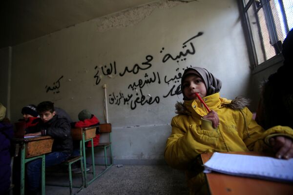Дети на уроке в городе Алеппо