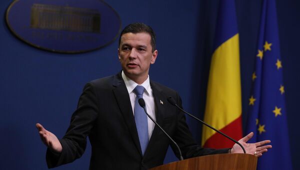 Премьер-министр Румынии Сорин Гриндяну выступает с речью в Бухаресте