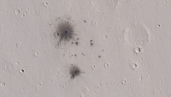 Следы метеоритного «выстрела» по поверхности Марса