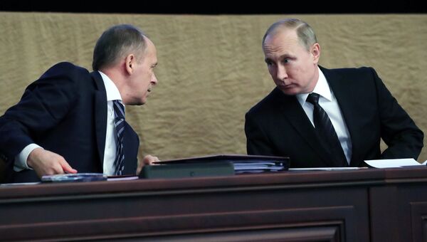 Президент РФ Владимир Путин и директор Федеральной службы безопасности Александр Бортников. Архивное фото