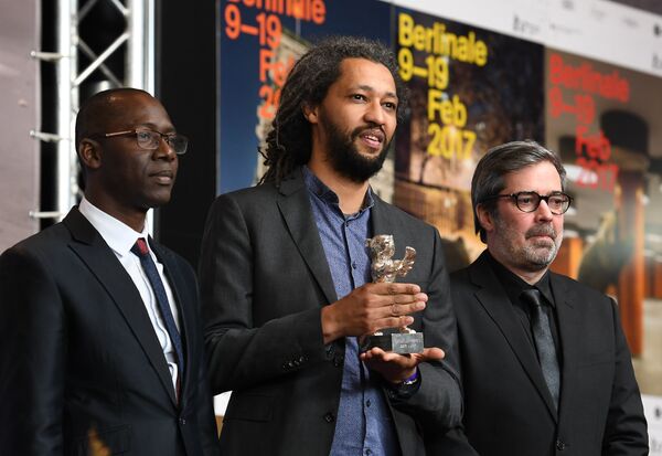 Режиссер Ален Гомис, обладатель Гран-при жюри, на пресс-конференции в рамках 67-го Берлинского международного кинофестиваля Берлинале - 2017