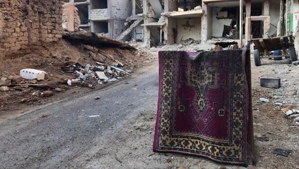 Разрушенные в результате боевых действий дома в сирийской провинции Хомс. Архивное фото