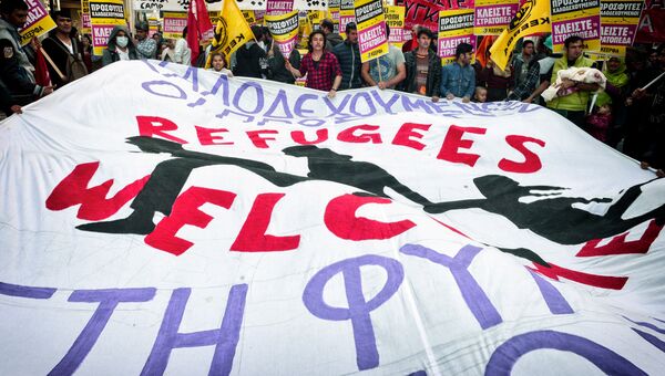 Акция протеста в поддержку мигрантов и с призывом отменить договоренность ЕС и Турции по беженцам в Афинах