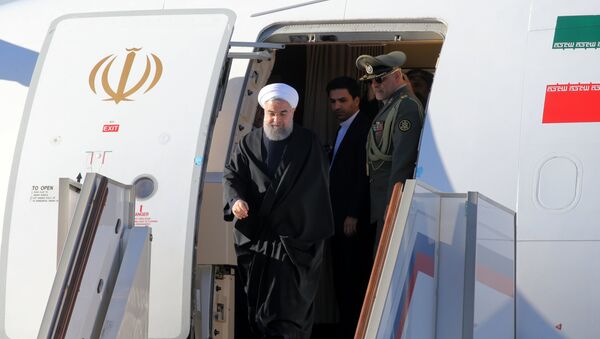 Президент Исламской Республики Иран Хасан Рухани, прибывший в Россию с официальным визитом, выходит из салона самолета в аэропорту Внуково-2. Архивное фото