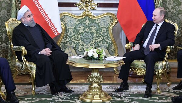Президент РФ Владимир Путин и президент Исламской Республики Иран Хасан Рухани во время встречи. 28 марта 2017