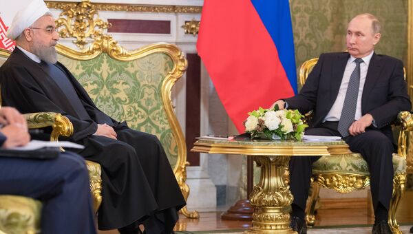 Президент РФ Владимир Путин и президент Исламской Республики Иран Хасан Рухани во время встречи в Москве. 28 марта 2017 года